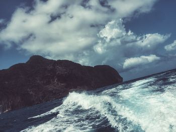 Scenic view of sea against cloudy sky