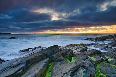 Rocks at sea during sunset