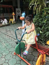 Rear view of girl looking at toys