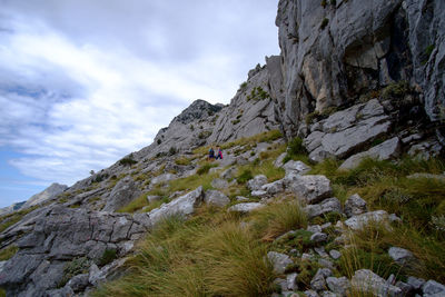 Low angle view of cliff against sky