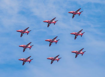 Low angle view of airplane flying in sky