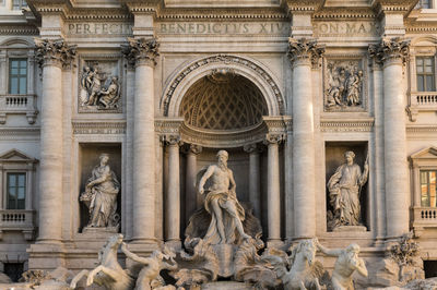 Statue of trevi in rome's historical fountain 