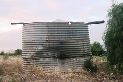 Scenic view of farm against sky