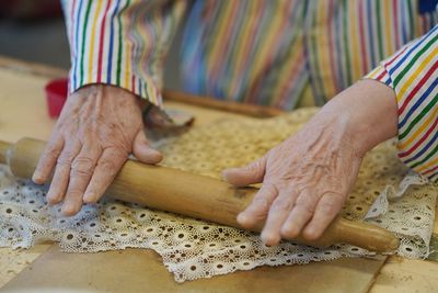 Midsection of woman preparing food