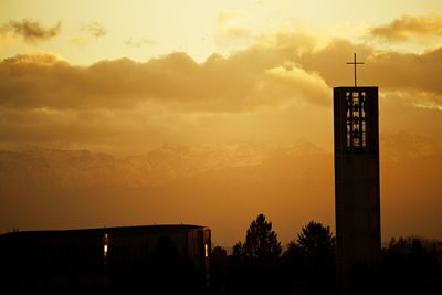 Low angle view of building against sky during sunset