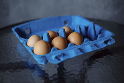 High angle view of eggs in container on table