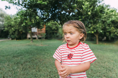 Cute girl standing outdoors