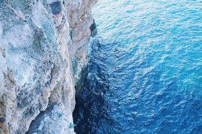 High angle view of rock formation in sea