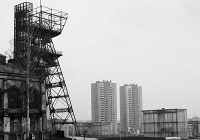 Low angle view of crane against sky