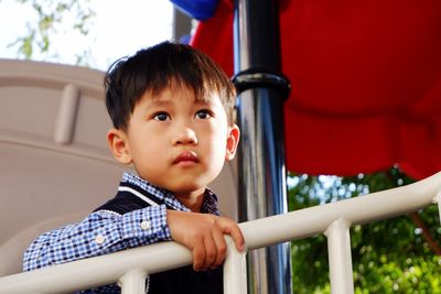 Close-up of cute boy looking away