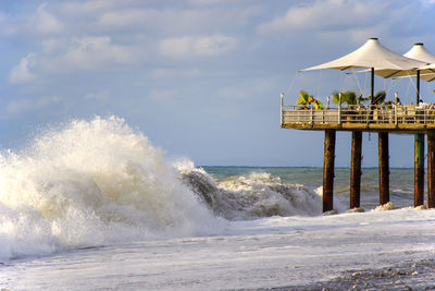 Stormy weather, waves and splashes in batumi, georgia. stormy black sea. water background.