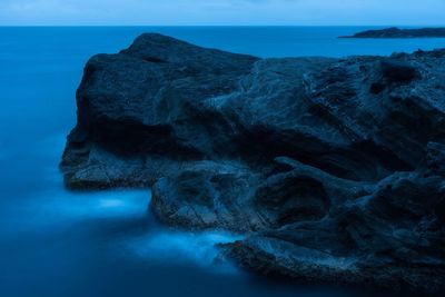 Close-up of rock formation in sea