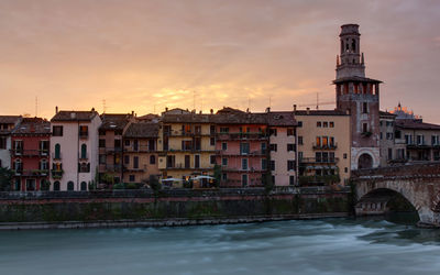 View of verona waterfront at sunset