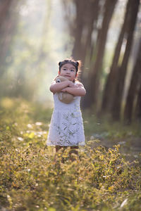 Full length of girl playing at park