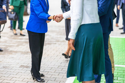 Female business persons or politicians welcome handshake before meeting