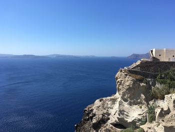 Scenic view of sea against clear blue sky