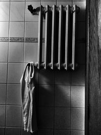 Tank top hanging on radiator in bathroom