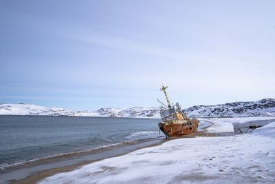 Scenic view of sea against sky during winter