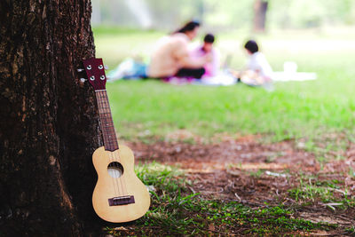 Man playing guitar in park