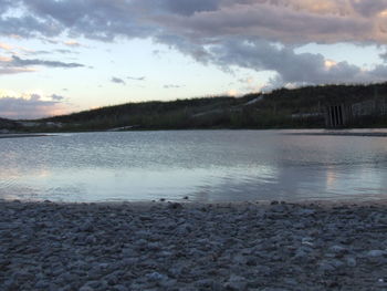 Scenic view of lake against sky during sunset