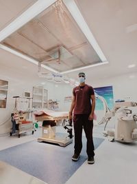 Full length of a man standing under construction