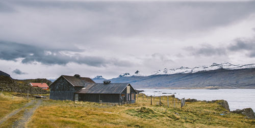 Buildings on mountain against sky