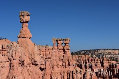 Low angle view of rock formations against blue sky bryce canyon 