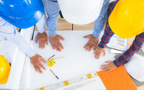 High angle view of people working at table