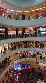 High angle view of people in illuminated room