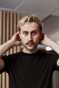 Portrait of young man looking at camera