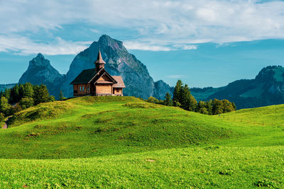 View of an old wooden church in the swiss mountains on lake lucerne.