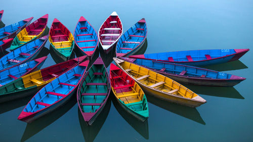 Colorful boats moored on lake