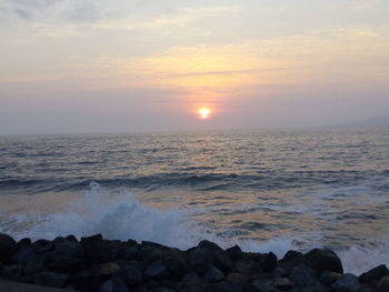 Scenic view of sea against sky during sunset