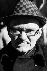 Close-up portrait of man wearing eyeglasses outdoors