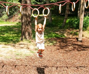 Full length of girl playing in playground