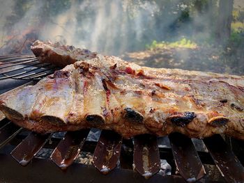 Close-up of meat on barbecue grill