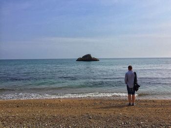 Rear view of people on beach