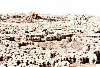 Aerial view of rocks against clear sky