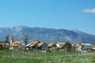 Scenic view of mountains against clear blue sky