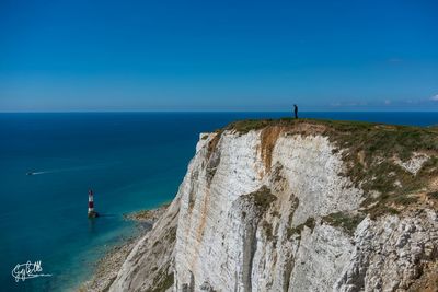 Scenic view of sea against blue sky