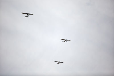 Low angle view of airplane flying in sky