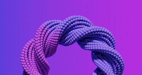 Close-up of rope against blue background