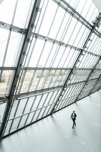 Male business professional walking in corridor