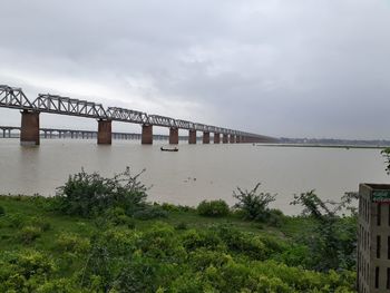Bridge over river against sky