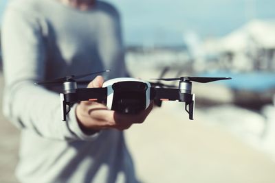 Close-up of man holding camera