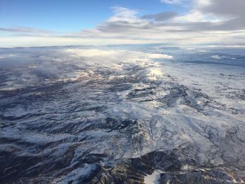 Aerial view of landscape against cloudy sky