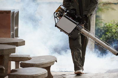 A worker use fumigation mosquitoes machine for kill mosquito