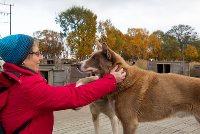 Side view of man with dog