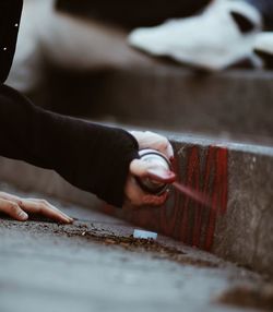 Lady spray painting 