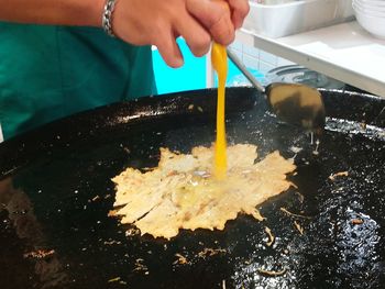 Close-up of person preparing food